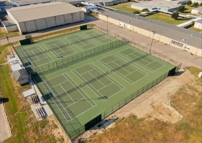 AFTER - Westbrook High School Beaumont ISD (100% 8 Tennis Courts Construction, Resurfacing, Lights system,Galvanized Fence around Tennis Courts & Sidewalk) Entregado Nov 2024